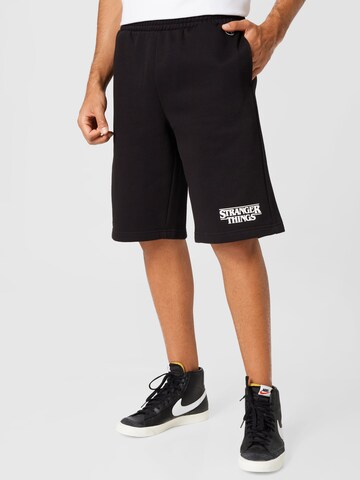 Champion Authentic Athletic Apparel Regular Trousers 'Bermuda' in Black: front