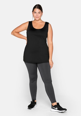 SHEEGO - Top deportivo en negro