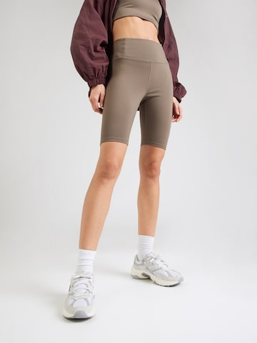 Girlfriend Collective Skinny Sportovní kalhoty 'Float' – hnědá: přední strana