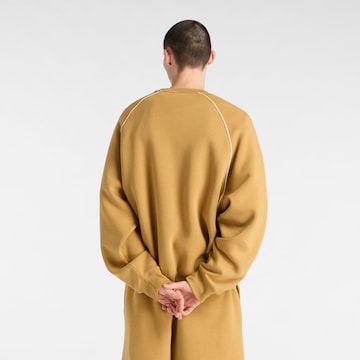 Sweat-shirt 'Trackside' new balance en jaune