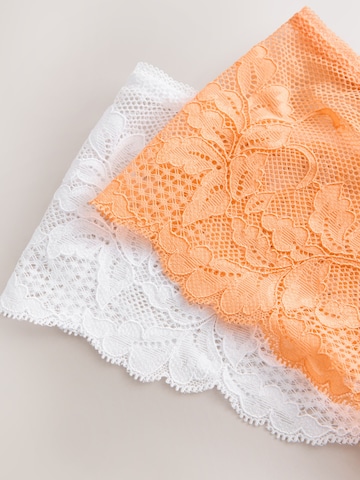 Next String i oransje
