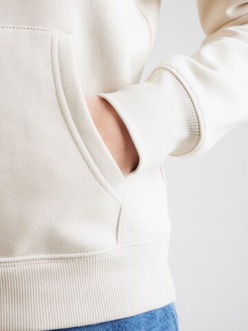 Felpa di Tommy Jeans in beige