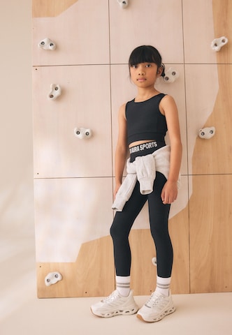 Skinny Leggings di Next in nero