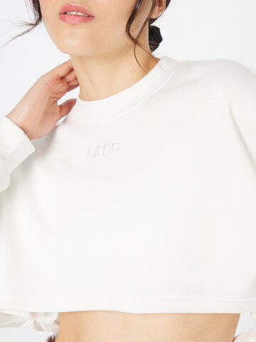 Sweat de sport aim'n en blanc