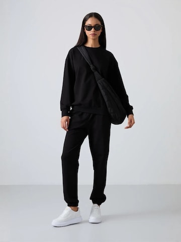 Tommy Life Sweatsuit in Black: front