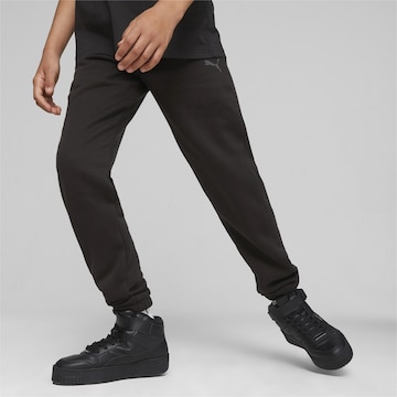 PUMA Regular Workout Pants 'MOTION' in Black: front