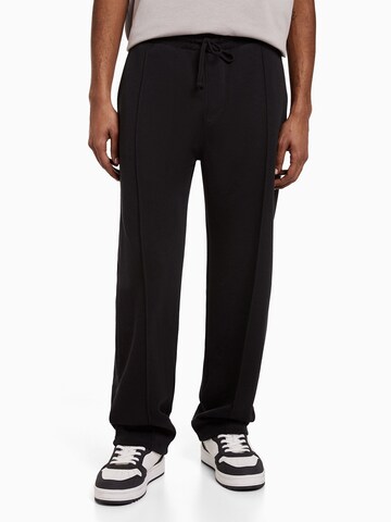 Bershka Loose fit Trousers with creases in Black: front