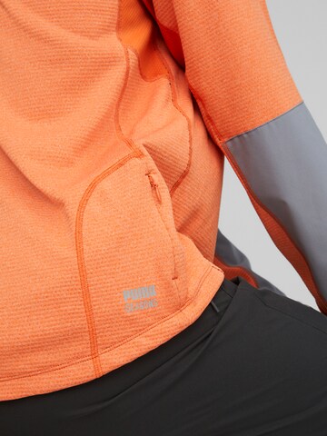 PUMA Functioneel shirt 'Seasons' in Oranje