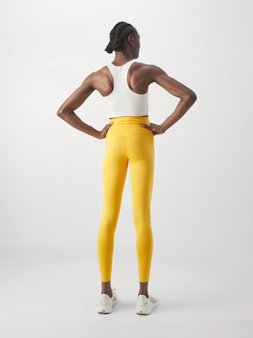 Girlfriend Collective Skinny Sporthose in Gelb