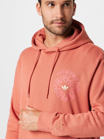 ADIDAS ORIGINALS Sweatshirt 'Graphic Ozworld' in Orange