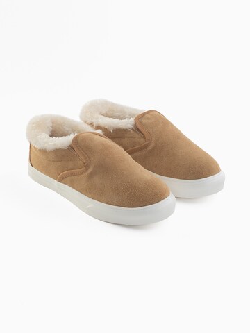 Slip on 'Wilder' Minnetonka en marron