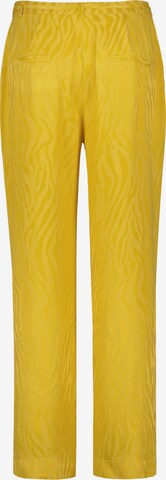 TAIFUN Lużny krój Spodnie w kolorze żółty