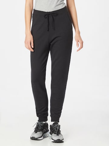 NIKE - Tapered Pantalón deportivo en negro: frente