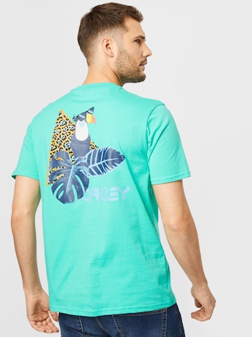 OAKLEY Λειτουργικό μπλουζάκι 'Toucan Tropical' σε πράσινο: μπροστά