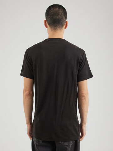 GUESS T-Shirt in Schwarz
