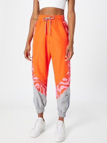 ADIDAS BY STELLA MCCARTNEY Tapered Workout Pants in Orange: front