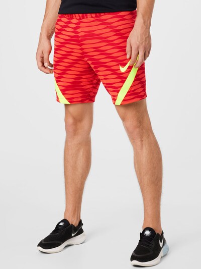 Sportinės kelnės iš NIKE, spalva – neoninė geltona / raudona / melionų spalva, Modelio vaizdas