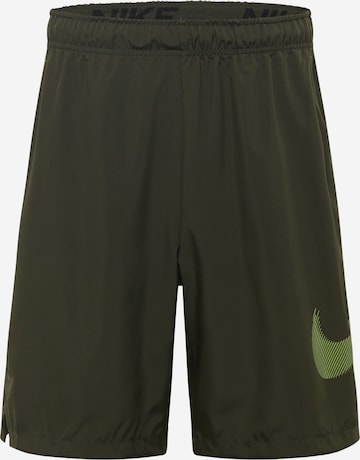 Loosefit Pantalon de sport NIKE en vert : devant