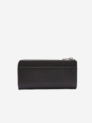 LACOSTE - Cartera 'Lacoste Compagnon cuir piqué Chantaco' en negro