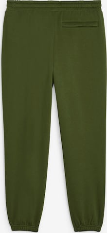 PUMA Zwężany krój Spodnie w kolorze zielony