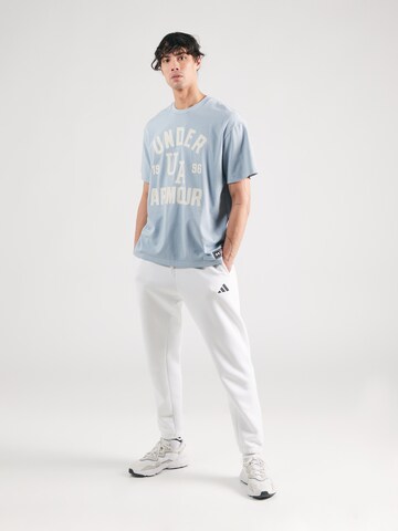 UNDER ARMOUR Koszulka funkcyjna 'VARSITY' w kolorze niebieski