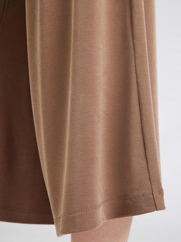 ABOUT YOU Wide leg Trousers 'Sana' in Beige