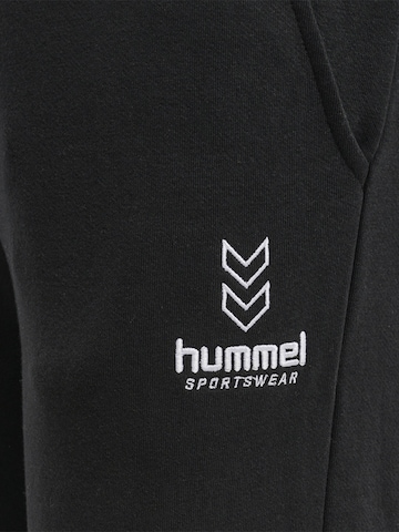 Effilé Pantalon de sport Hummel en noir