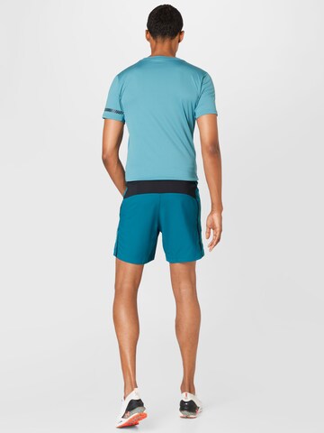 Regular Pantaloni sport de la ASICS pe verde