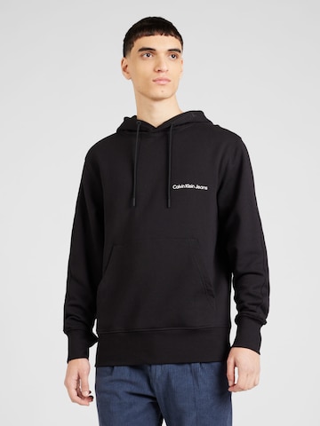 Sweat-shirt Calvin Klein Jeans en noir : devant