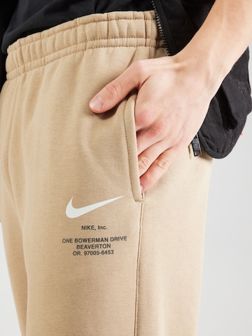 Tapered Pantaloni de la Nike Sportswear pe bej