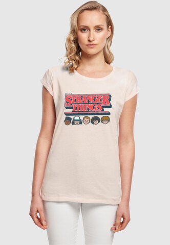 ABSOLUTE CULT Shirt ' Stranger Things - Caricature' in Roze: voorkant