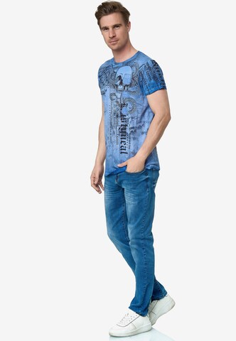 Rusty Neal T-Shirt mit All Over Print in Blau