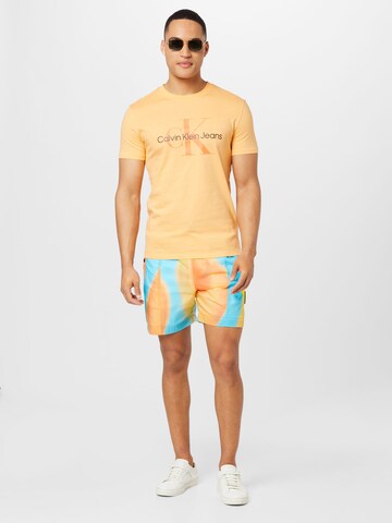 Calvin Klein Jeans Regularen Hlače | oranžna barva