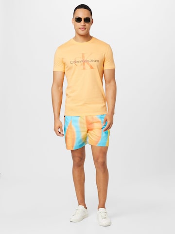 Calvin Klein Jeans Štandardný strih Nohavice - oranžová