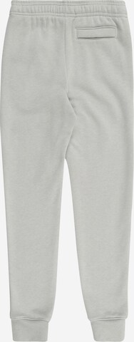 UNDER ARMOUR Tapered Urheiluhousut 'RIVAL' värissä harmaa