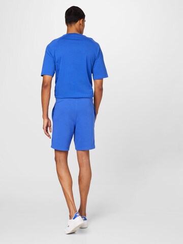 Champion Authentic Athletic Apparel Normalny krój Spodnie w kolorze niebieski