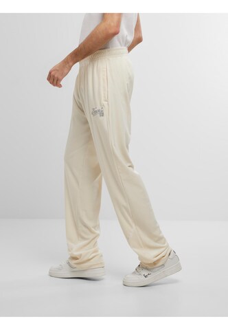 Loosefit Pantalon de sport ' ' Karl Kani en beige
