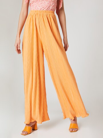 ABOUT YOU x Laura Giurcanu Loose fit Pants 'Christin' in Orange: front