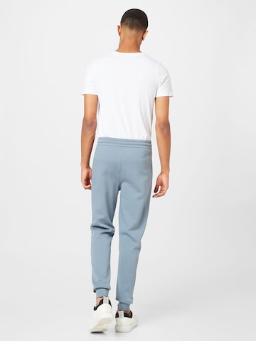 Calvin Klein Дънки Tapered Leg Панталон в синьо