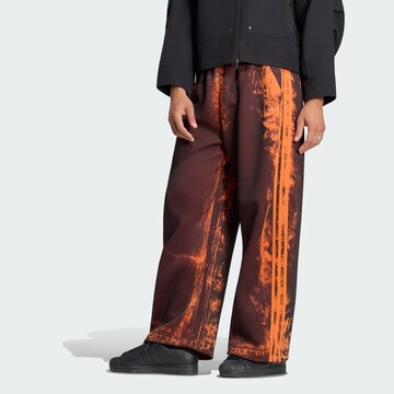 ADIDAS ORIGINALSWide Leg/ Široke nogavice Hlače 'Adilenium 6' - narančasta boja: prednji dio