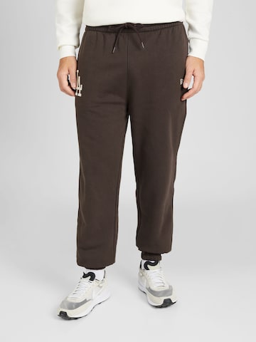 NEW ERA Tapered Pants 'LEAGUE ESSENTIALS' in Brown: front