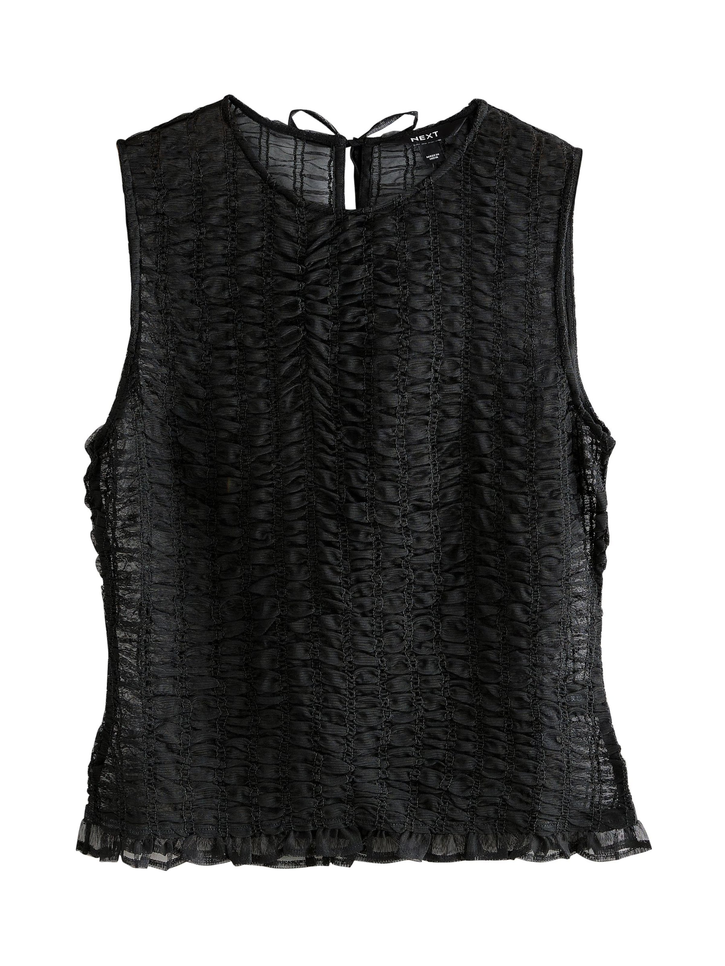 Next Blus i svart: framsida