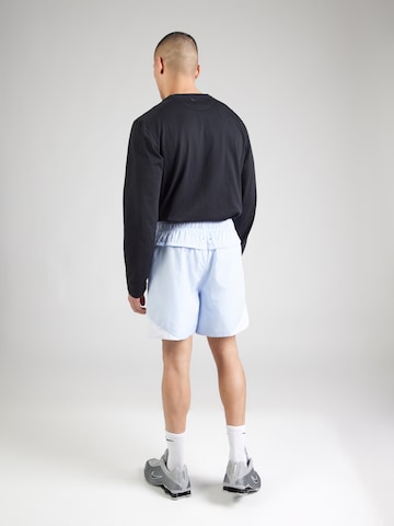 Largi Pantaloni 'WR' de la Nike Sportswear pe albastru
