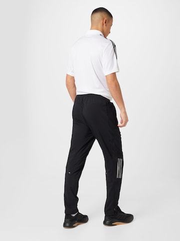 ADIDAS PERFORMANCE Tapered Sporthose 'Own The Run Astro' in Schwarz