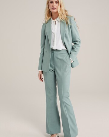 WE Fashion Flared Trousers with creases in Green
