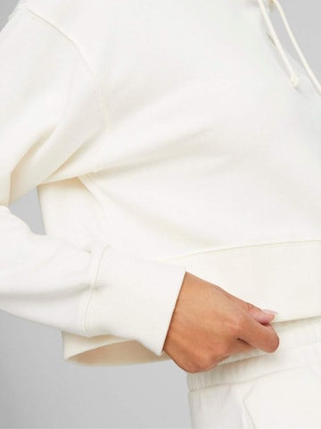 PUMA - Sudadera con cremallera 'Puma Classics Cropped Hoodie' en blanco