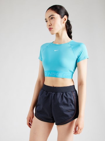 NIKE - Camiseta funcional en azul
