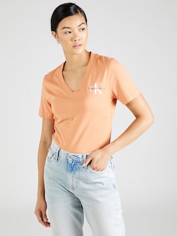 Calvin Klein Jeans Koszulka w kolorze pomarańczowy: przód