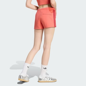ADIDAS ORIGINALS Slim fit Trousers in Red