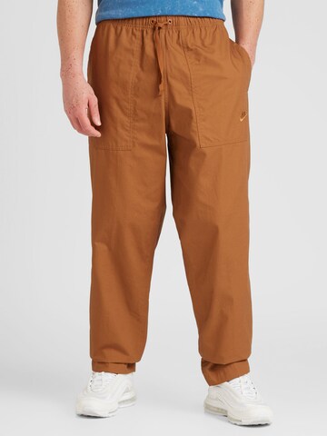 Nike Sportswear Loose fit Pants 'CLUB BARCELONA' in Brown: front